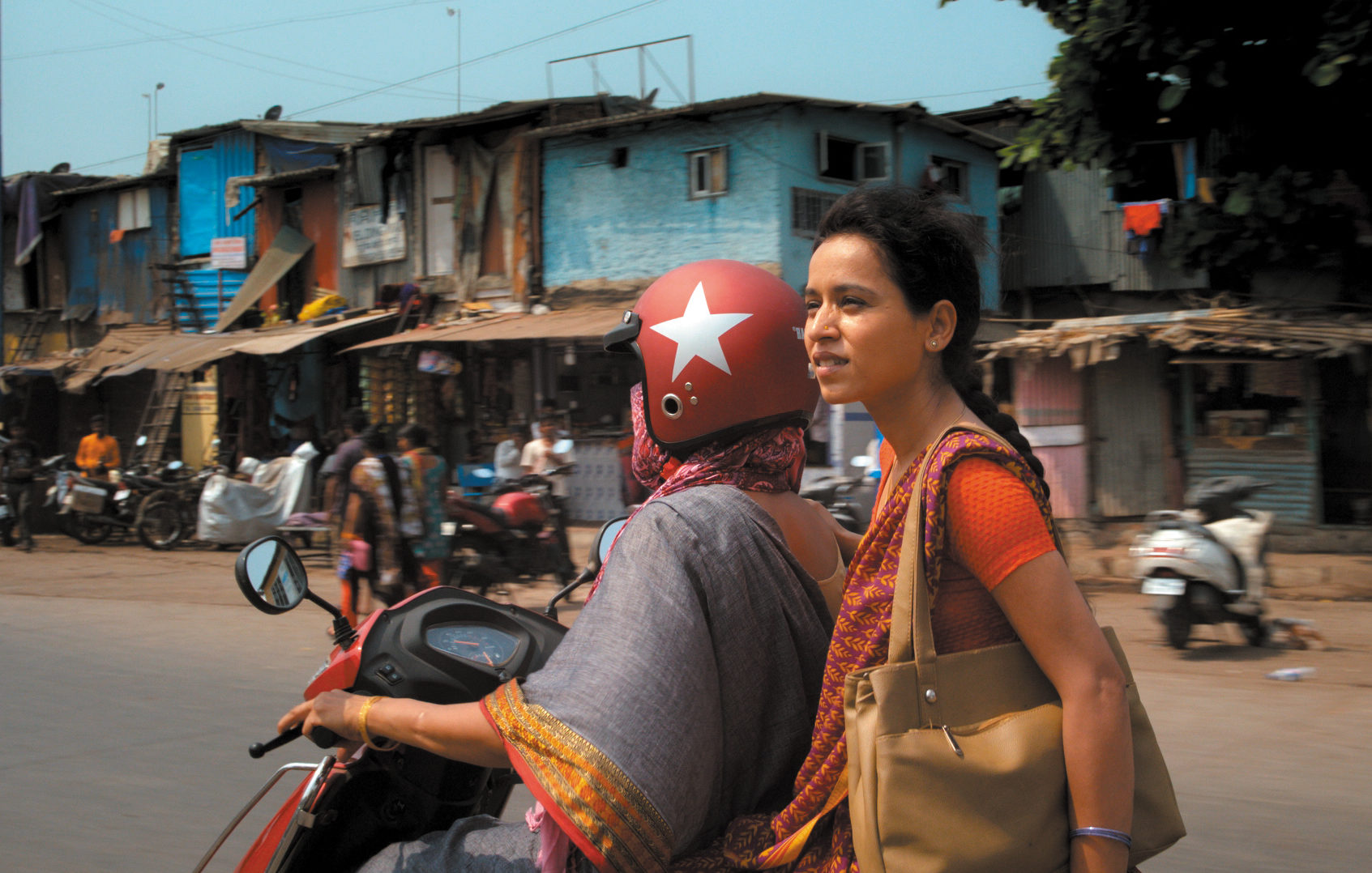 Man and woman on moped